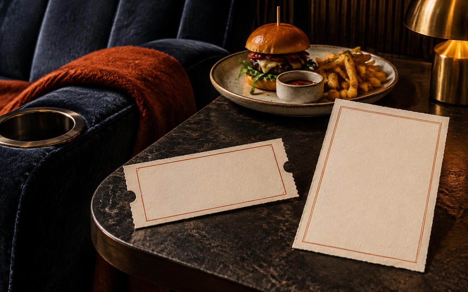 Conceptual editorial collage of a premium cinema seat, plated meal and two clearly separate blank ticket and dining-package cards.